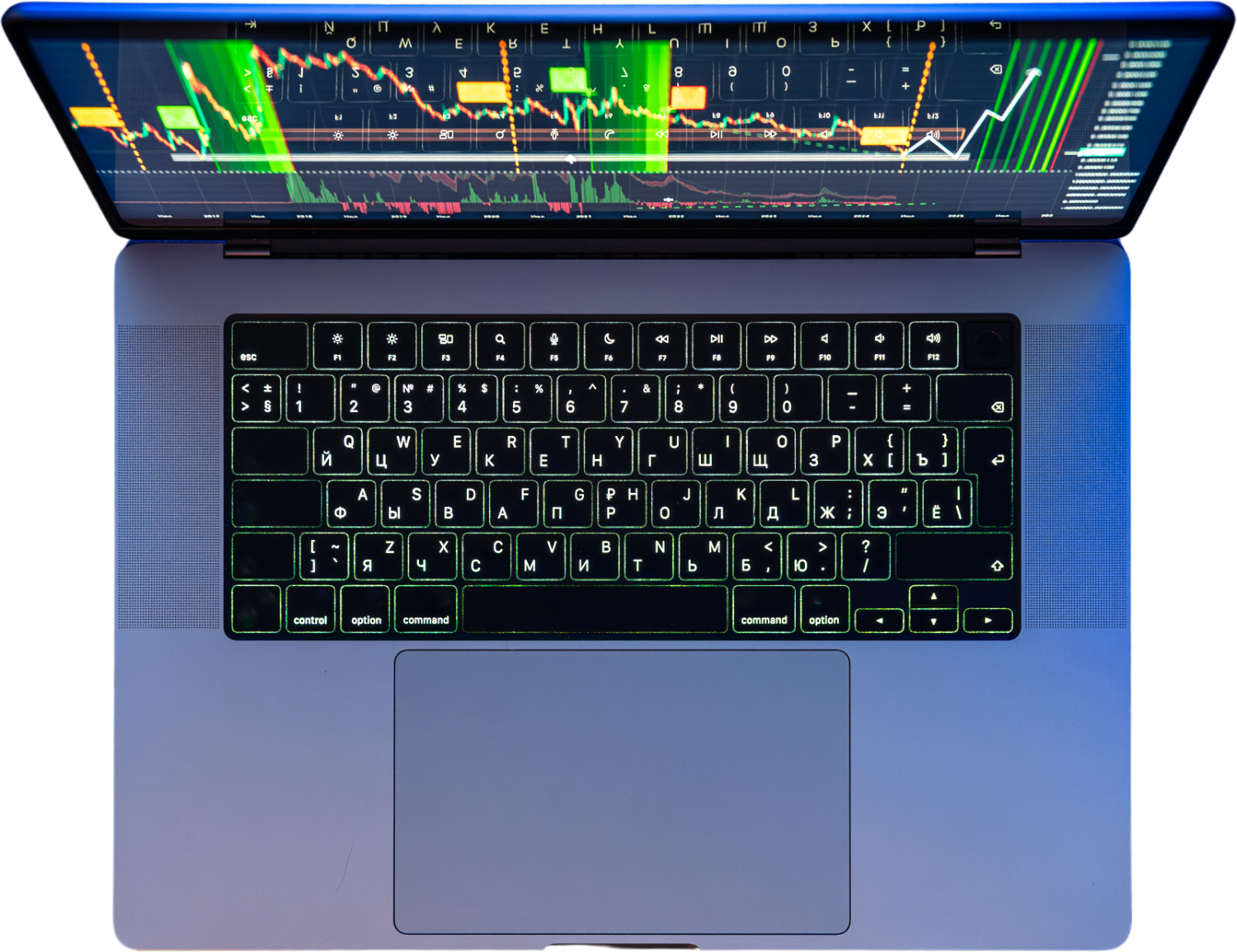 Laptop seen from above with a trading chart on screen